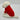 White dog wearing a red sweater on a light gray background